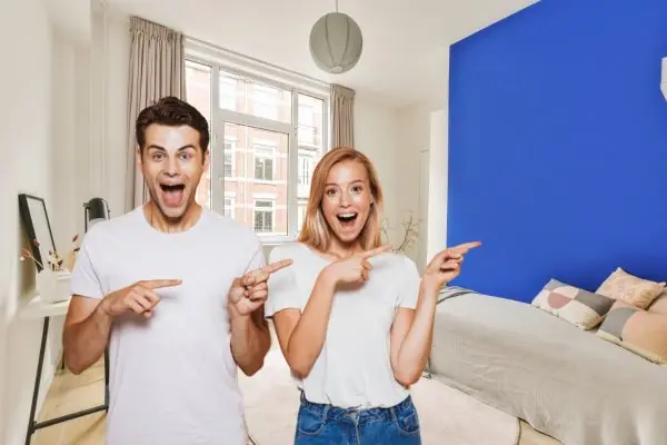 happy couple on their new accent wall paint