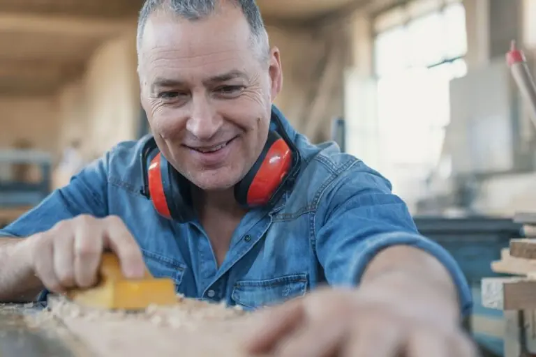 man enjoying his carpentry job