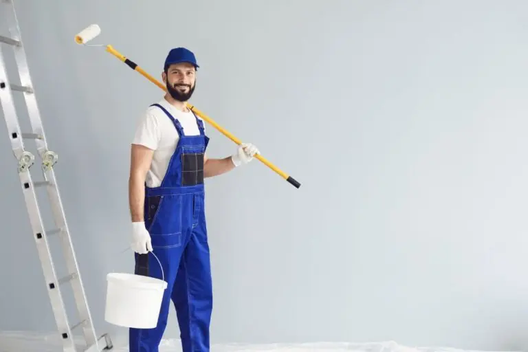 Painting Contractors Enjoying Painting House Interior