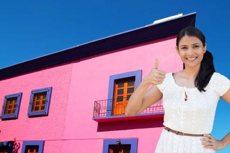 mexican pink house facade wooden doors