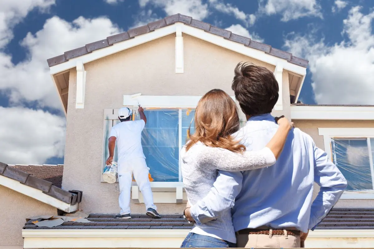 couple looking on their house